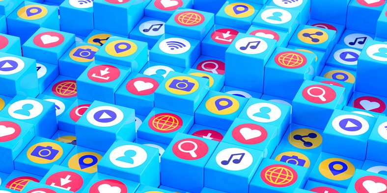 Colorful 3D cubes with various social media and app icons, including hearts, cameras, music notes, and location pins, symbolizing the digital landscape of connectivity and interaction.